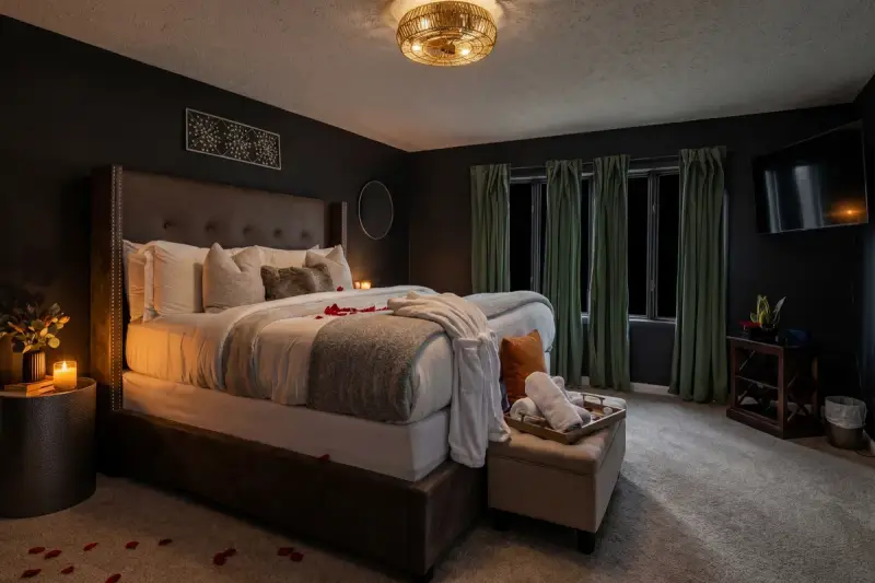 Intimate bedroom with warm candlelight and cozy decor